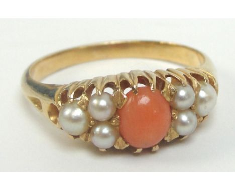 A yellow metal coral and seed cultured pearl ring in high claw setting, size M, approx 4.3g.