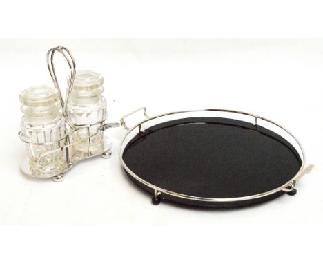 An early 20th century electroplated double preserve jar stand with central wire loop handle and with pickle fork rests to bot
