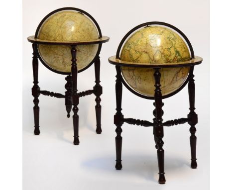 A pair of late 19th century 18" terrestrial and celestial globes by C. Smith & Son, each set within a ring turned and block f