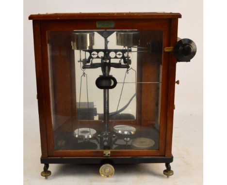 A wooden cased set of chemical balance scales by Towers of Widnes, width approx 46cm.