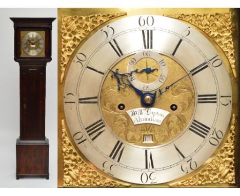 A George III oak and crossbanded eight day longcase clock, the moulded cornice above 12" brass dial set with silvered chapter