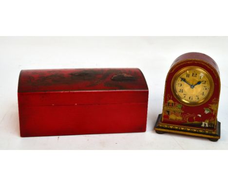 A red lacquer cigarette box, the hinged domed lid bearing an Oriental landscape, width 19cm, and a matching domed small mante
