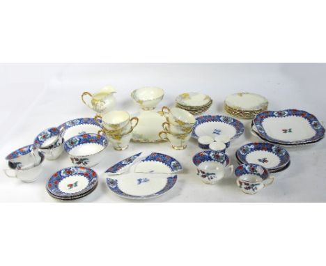 An Aynsley "Woodland Bluebell" pattern tea service comprising six trios, sugar bowl, milk jug and a sandwich plate and an Ayn