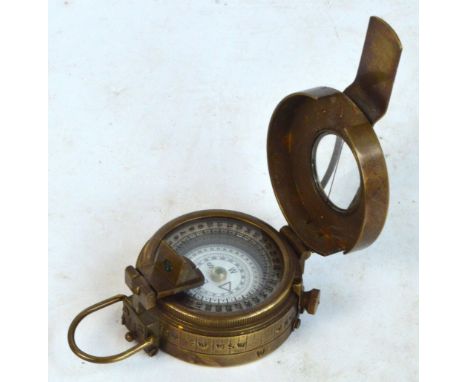 A WWII military brass compass by TG & Co Ltd, London, inscribed to rear "N A266322, 1940, MK II".