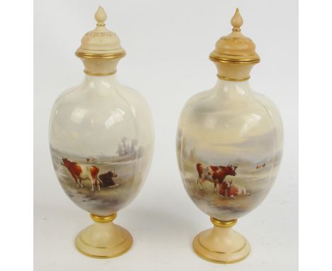 A pair of Royal China Works Worcester vases with covers of baluster form, with gilt heightened flared rims and feet, hand pai