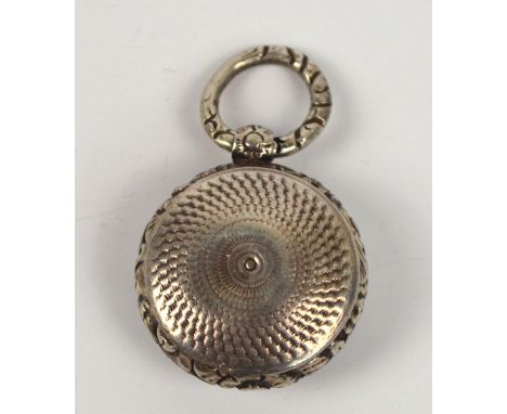 A George IV hallmarked silver circular vinaigrette with overall engine turned and floral decoration, the hinged lid enclosing