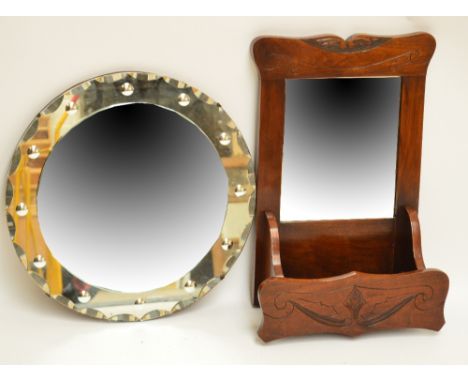 An Edwardian walnut wall mirror with trinket section and a circular wall mirror (2).
