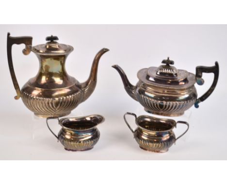 An Elizabeth II hallmarked silver four piece tea service with gadrooned decoration to lower part of the bodies, comprising te