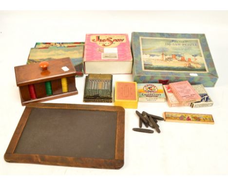 Four vintage playing card sets, three boxed sets of wooden jigsaw puzzles, a mahogany pivot token dispenser, etc.