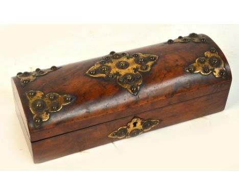 A Victorian walnut and Gothic brass mounted stud decorated domed trinket box, width 29cm.