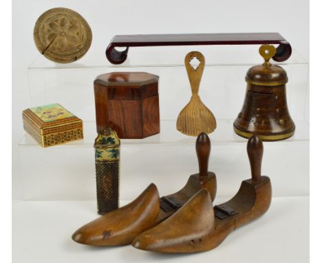 A group of treen including a pair of shoe lasts, a money box modelled as a bell and a trinket box, also a Persian box, a lacq