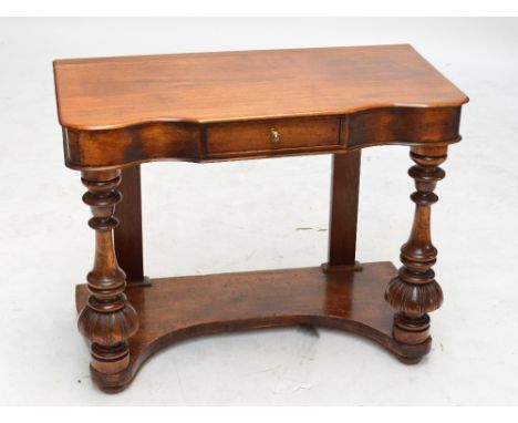 A mahogany single drawer shaped hall side table, on ring turned and carved front legs and with shaped undertier, 90 x 44 cm, 