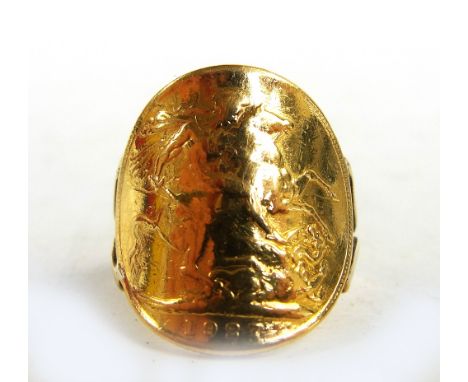 A George V full sovereign, 1927, converted to a ring with yellow metal band.
