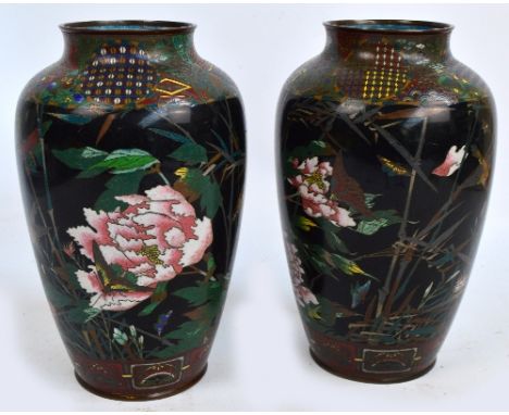 A pair of large Japanese Meiji period cloisonné vases of baluster form, decorated with birds and butterflies amongst chrysant