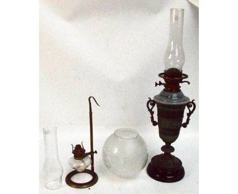 A twin handled urn shaped oil lamp with grey glass reservoir and globular etched shade, height 68cm including funnel and a br