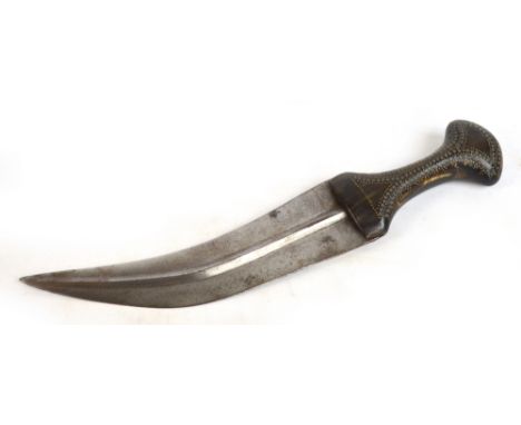 A 20th century Jambiya dagger with horn handle set with metal studs to one side, length 29cm, without scabbard. CONDITION REP