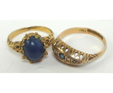 An 18ct gold sapphire and diamond five stone ring, size M, approx 1.7g, and a 9ct gold dress ring set with oval blue cabochon