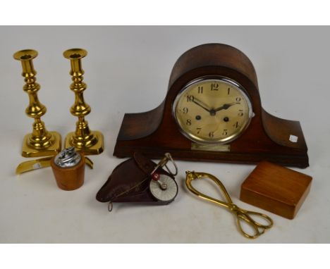 A 1930s oak cased Napoleon hat eight day clock, the circular dial set with Arabic numerals,with a presentation plaque engrave