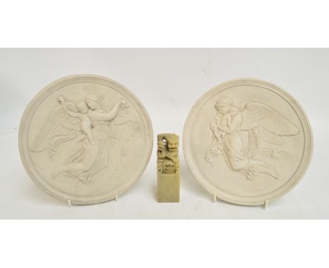 A pair of circular plaster wall plaques, one depicting Nike and Eros, the other depicting Athena with Nike as her owl, diamet