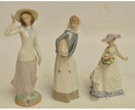 Three Lladro figures; 5682 "Breezy Afternoon", 5790 "Carefree" and 4584 "Girl with Lamb" (3). CONDITION REPORT: Some chipping