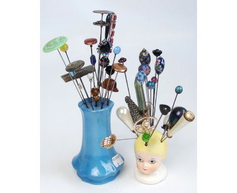 A quantity of vintage hatpins including examples made of millefiori type glass, coloured glass, ceramic, pearl beads, wood, d
