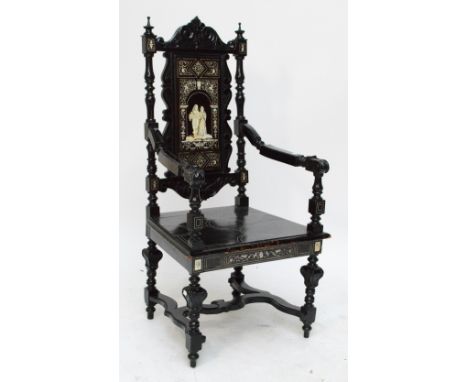 A 19th century north Italian ebonised and ivory inlaid Renaissance style high backed elbow chair with detailed panel centred 