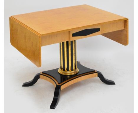 A contemporary Biedermeier satinwood ebonised and gilt heightened sofa table, the rectangular top with twin flaps, twin friez