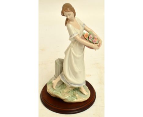 A boxed Lladro figure; 7704 "Gardens of Athens", with stand. CONDITION REPORT: Appears good with no obvious signs of faults, 