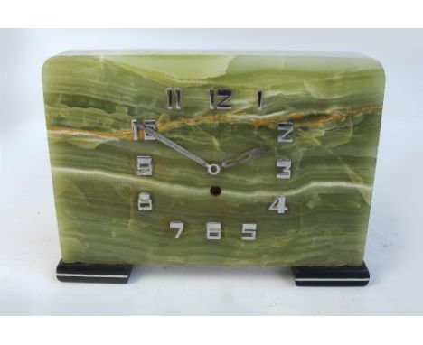 An Art Deco square onyx mantel clock set with chrome stylised Arabic numerals and raised on square feet, height 23cm, width 3