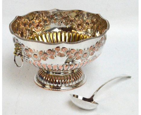 An electroplated copper punch bowl with embossed floral motifs and with gadrooned decoration to the lower part of the body an