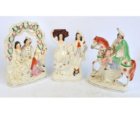 Three large late 19th century Staffordshire figure groups, one depicting a man seated upon a horse (af), one depicting lovers
