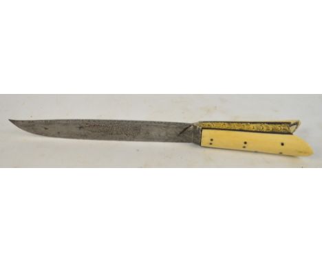 A late 19th/early 20th century Eastern dagger with V-cut bone mounted handle and engraved decoration to blade, length of blad