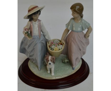 A boxed Lladro figure group; 06250 "Spring Time Harvest", height 22cm, with stand. CONDITION REPORT: Appears good with no obv