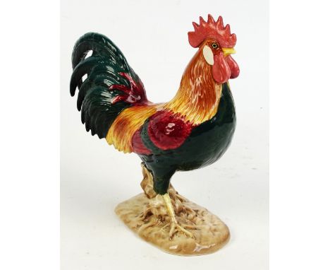 A Beswick model of a leghorn cockerel, in teal green, red, orange and yellow, model 1892, height 24.5cm, width 24cm. CONDITIO