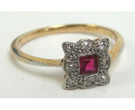 An 18ct gold ruby and diamond Art Deco set ring, the shaped square section panel centred with a square cut ruby within a bord