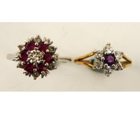 A 9ct white gold diamond and ruby coloured stones cluster ring, size K/L, and a similar yellow metal example (2).