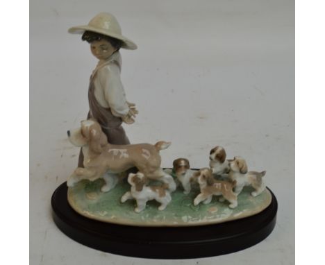 A boxed Lladro figure group; 06828 "My Little Explorers", width 25.5cm, with stand. CONDITION REPORT: Appears good with no ob