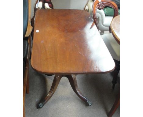 A mahogany rounded rectangular tilt top table, on ring turned column to four cabriole legs with paw feet to castors, 123 x 61