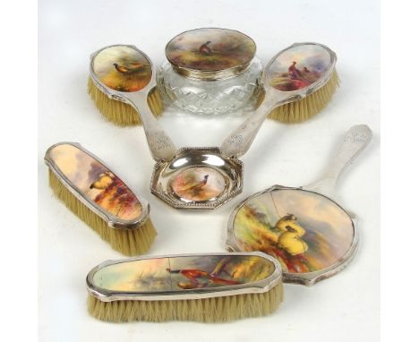 A seven piece hallmarked silver mounted dressing table set, each piece set with a hand painted Royal Worcester plaque, compri