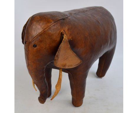 OMERSA; a vintage stitched leather stool in the form of an elephant, length 59cm. CONDITION REPORT: Wear and small tear to ta