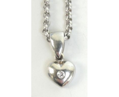 CHOPARD; an 18ct white gold chain, length approx 42cm, approx 8.5g, suspending a small 18ct white gold diamond set heart shap