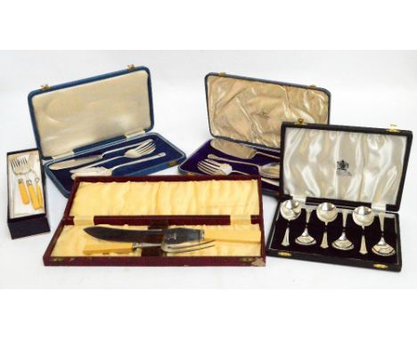 A group of cased electroplated flatware including two sets of three dessert servers, pair of ivorine handled carving tools, e