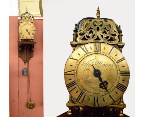 THOMAS MOORE, IPSWICH; a 19th century brass weight driven lantern clock, the circular dial set with Roman numerals to chapter