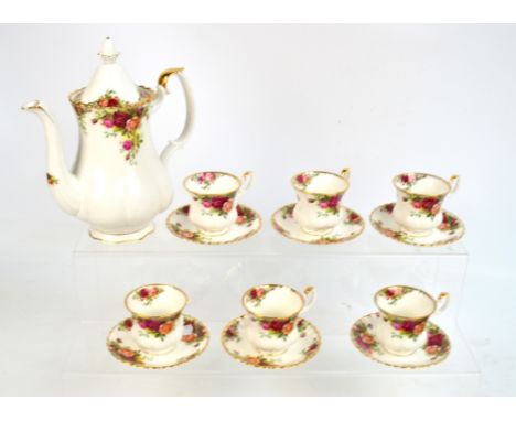 A Royal Albert "Old Country Roses" pattern coffee service comprising coffee pot and six cups with saucers (one cup af).