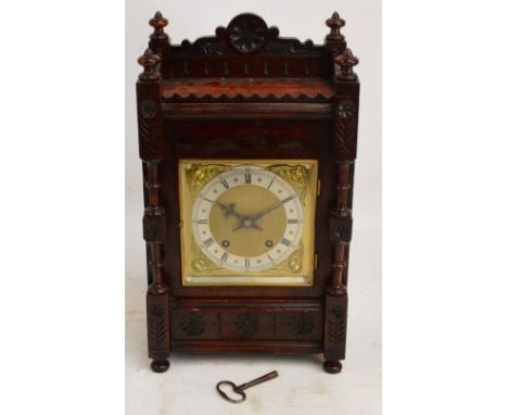 A c.1900 German oak cased mantel clock with square section dial, silvered chapter ring, eight day movement by Winterhalder & 