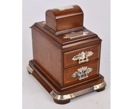 An Edwardian oak and electroplated mounted trinket box with two sectioned pull-out drawers with attached smaller trunk shaped
