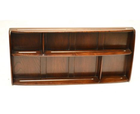An Ercol wall mounted plate rack, width 107cm.