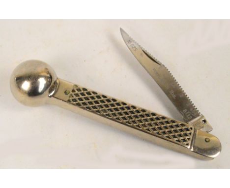 A stainless steel combination priest and skinning knife by "Duma Solingen Germany", the blade inscribed with a measuring gaug
