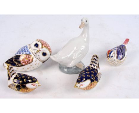 Four Royal Crown Derby paperweights; a recumbent owl (silver stopper), a goldcrest (silver stopper) and two wrens (both gold 