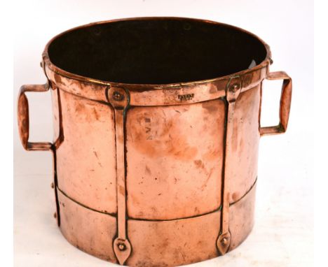An Arts and Crafts copper twin handled planter stamped to both sides of the rim "JMBERT PILS."(?), diameter 33cm, height 28cm